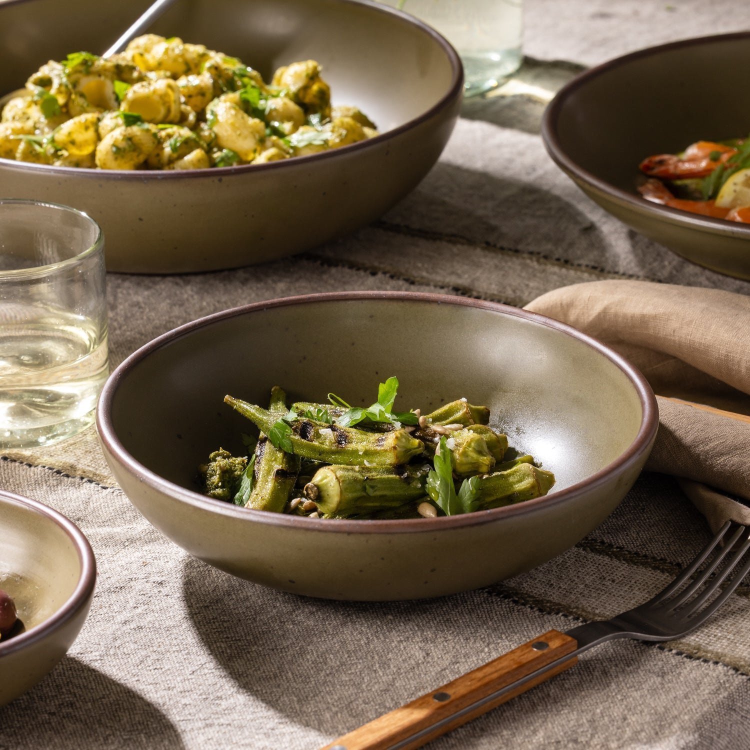 Pine Green Heova daily bowl with vegetables in a table setting